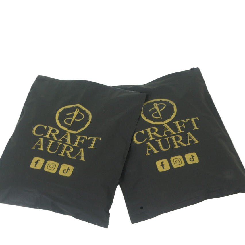 Two black packaging bags with 'Craft Aura' branding on a white background