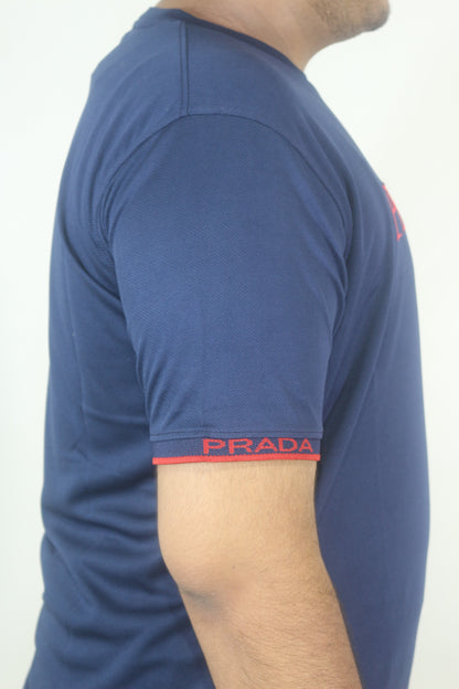 Close-up of a person wearing blue shorts with a visible brand logo on a white background