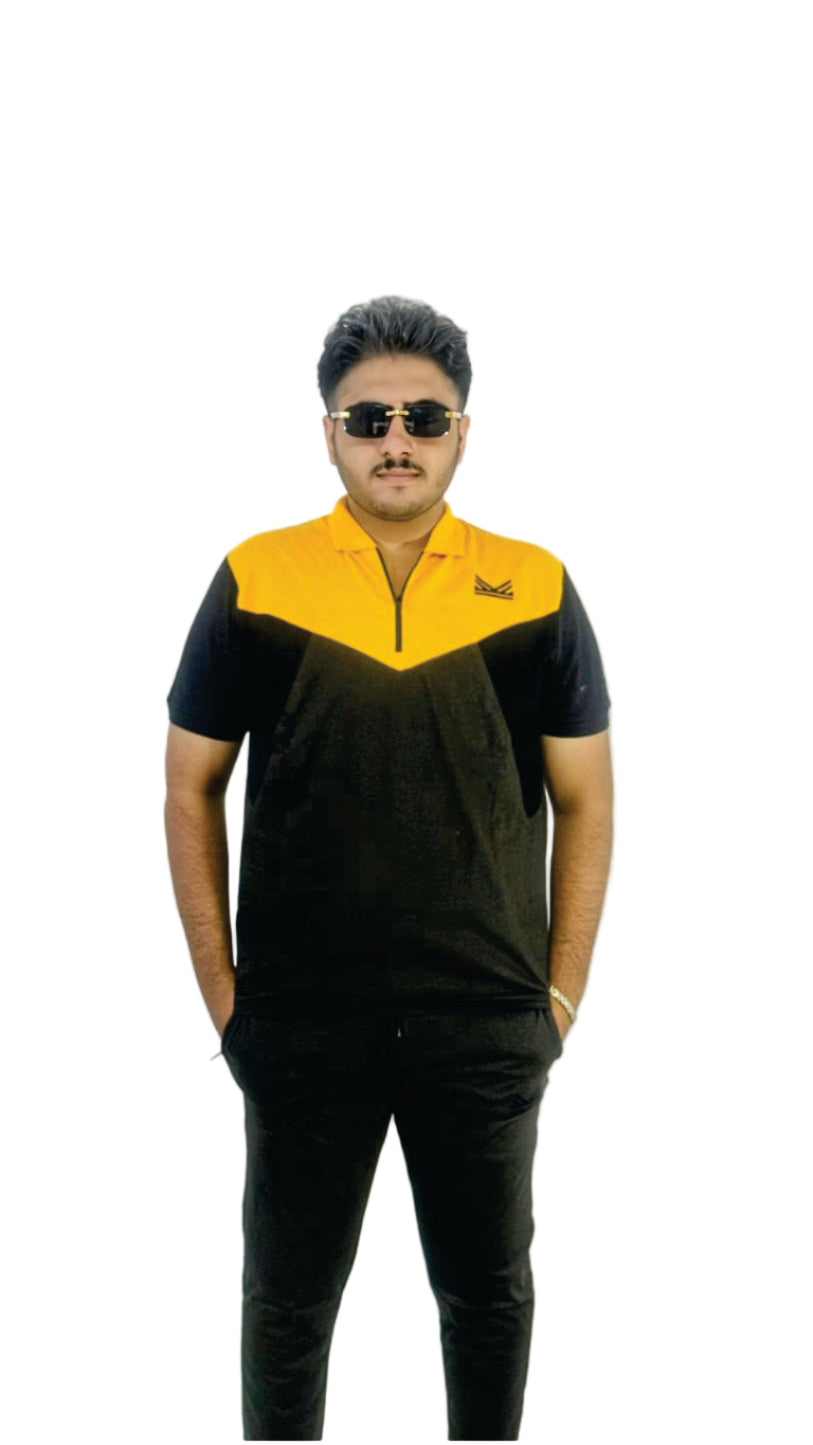 Person wearing a black and yellow outfit with sunglasses on a white background