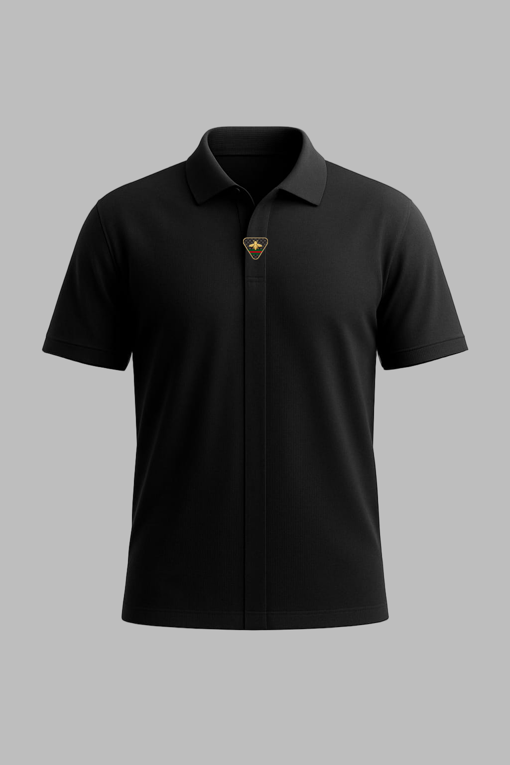 Black polo shirt with a logo on a gray background